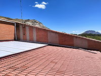 Sustitución de cubiertas en Colegio Público de Bustarviejo (Madrid). <br> Cubiertas. Cubierta de panel sándwich y teja, y lucernario de policarbonato